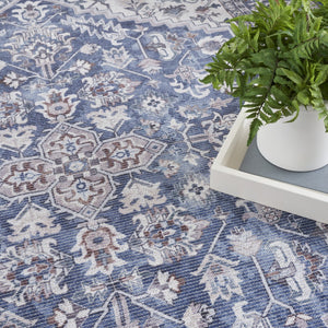 HomeRoots 9' X 12' Floral Power Loom Distressed Washable Area Rug for Timeless Elegance in Any Room Blue, Ivory 533133