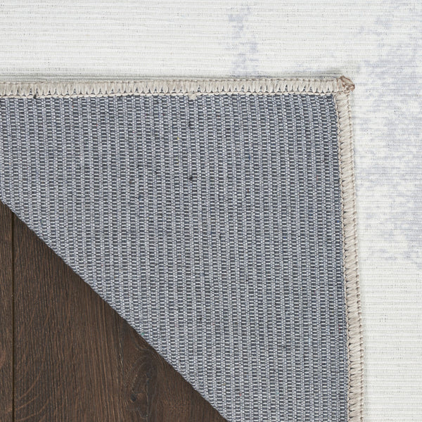 Homeroots 5' X 7' Ivory And Blue Abstract Power Loom Washable Non Skid Area Rug  Cotton Blend 533168