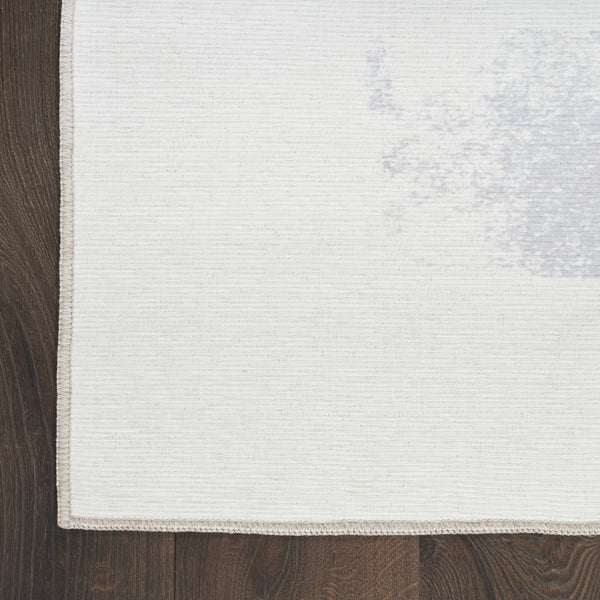 HomeRoots 8' Ivory and Blue Abstract Area Rug - Stylish, Washable, Non-Skid Design for Modern Living Spaces 8' X 10' 533183