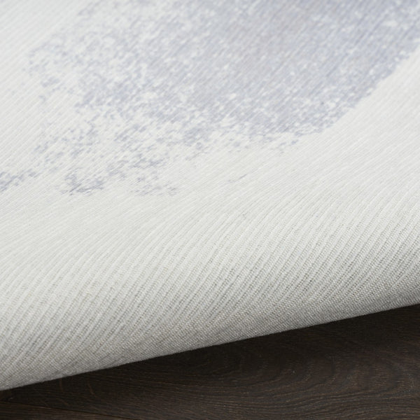 HomeRoots 8' Ivory and Blue Abstract Area Rug - Stylish, Washable, Non-Skid Design for Modern Living Spaces 8' X 10' 533183