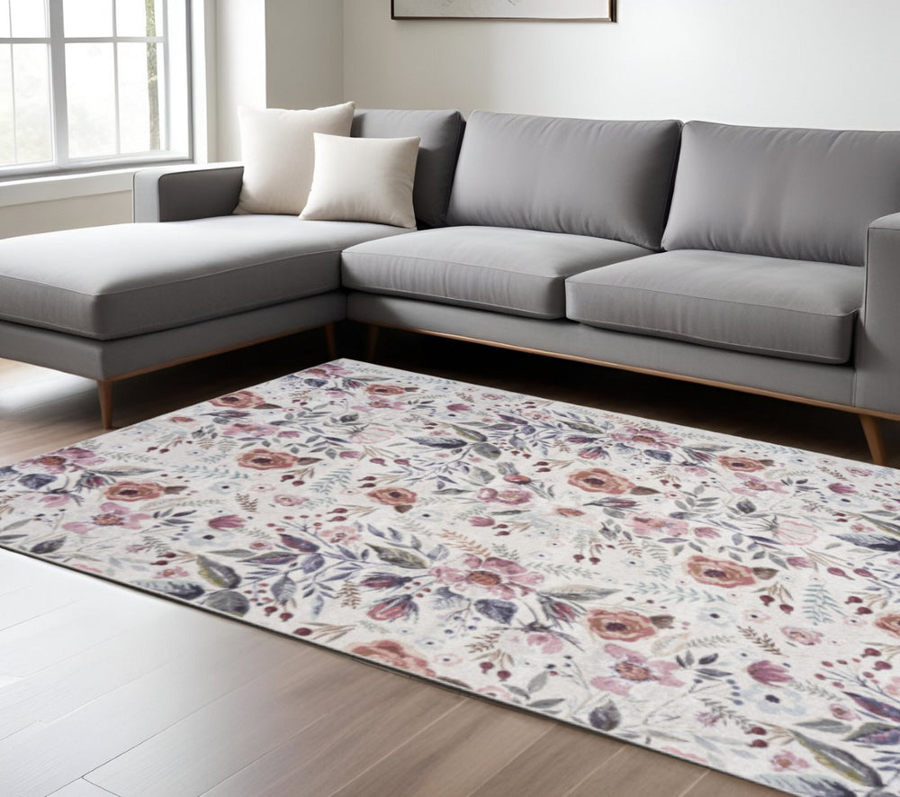 HomeRoots 9' Floral Distressed Washable Area Rug in Ivory Pink & Green - Vintage Charm for Any Room 9' X 12' 533235