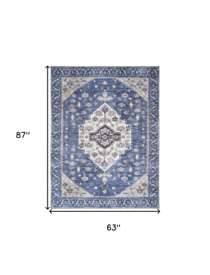 Homeroots 5' X 7' Blue And Beige Oriental Power Loom Distressed Washable Non Skid Area Rug  Polyester 533299