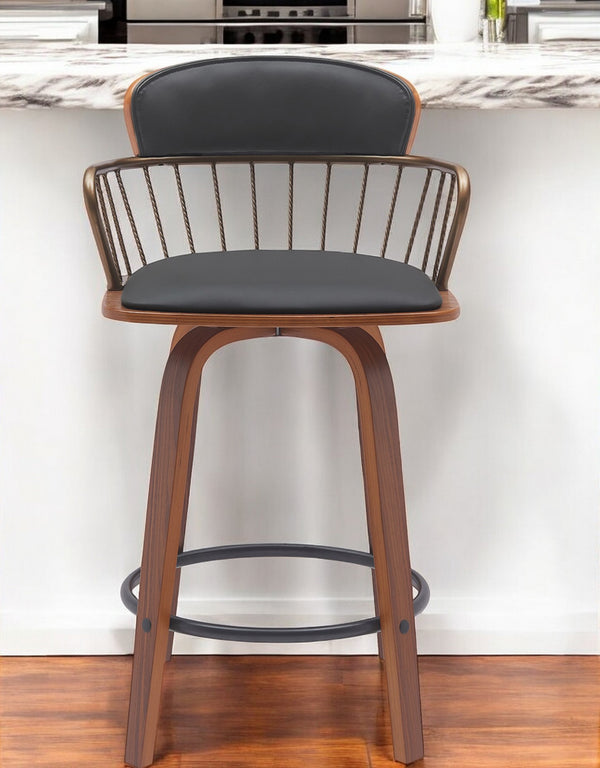 Homeroots 26" Black And Wood Brown Faux Leather Swivel Low Back Counter Height Bar Chair   534442