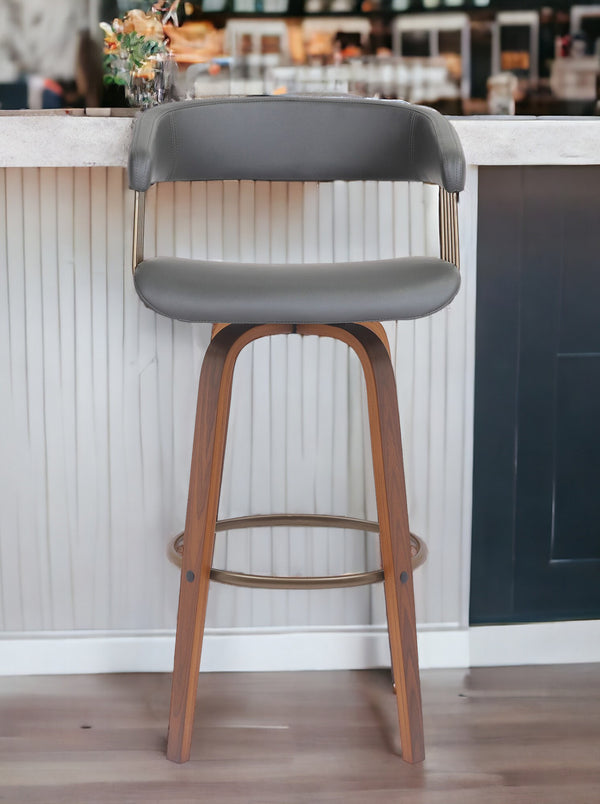 Homeroots 31" Gray And Wood Brown Faux Leather Swivel Bar Height Bar Chair   534470