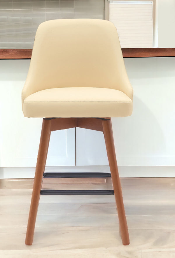 Homeroots 26" Cream And Wood Brown Faux Leather With Solid Wood Swivel Counter Height Bar Chair   534480