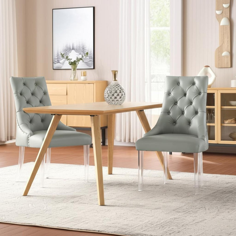 HomeRoots Set of Two Stylish Tufted Gray Faux Leather Dining Chairs with Clear Lucite Legs for Modern Spaces 543510