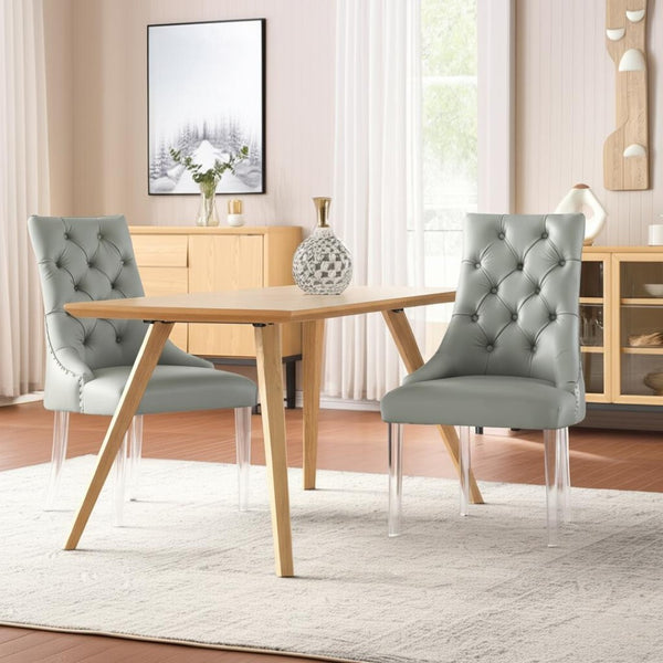 HomeRoots Set of Two Stylish Tufted Gray Faux Leather Dining Chairs with Clear Lucite Legs for Modern Spaces 543510
