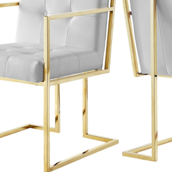 HomeRoots Set of Two Elegant Tufted White & Gold Faux Leather Dining Armchairs for Stylish Comfort 543516