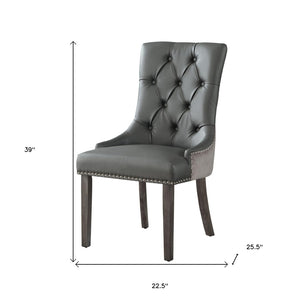HomeRoots Set of Two Stylish Tufted Dark Gray & Black Faux Leather Dining Chairs for Versatile Spaces 543521