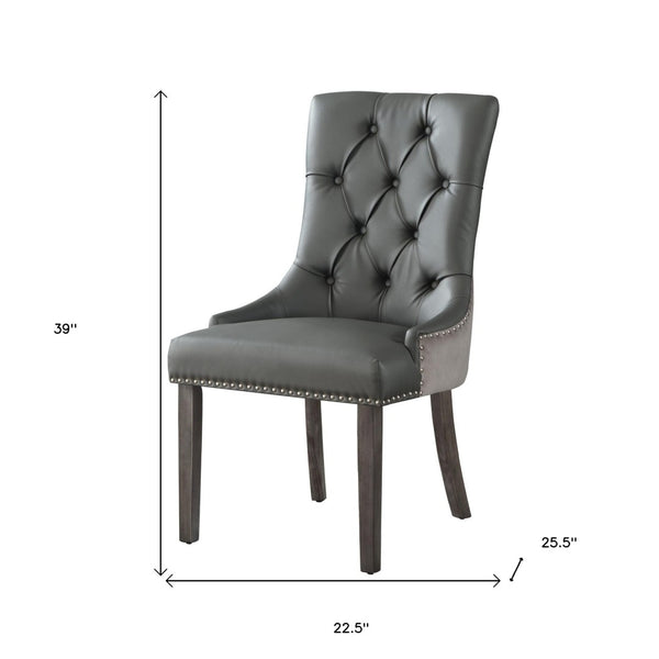 HomeRoots Set of Two Stylish Tufted Dark Gray & Black Faux Leather Dining Chairs for Versatile Spaces 543521