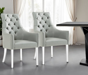HomeRoots Set of Two Elegant Tufted Gray Faux Leather Dining Arm Chairs with Clear Legs for Versatile Seating 543544