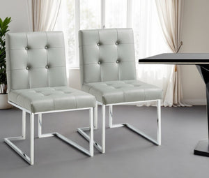 HomeRoots Set of Two Modern Tufted Light Gray Faux Leather Dining Side Chairs with Silver Metallic Legs 543549