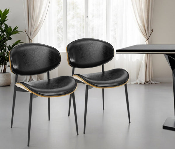 HomeRoots Set of Two Stylish Faux Leather and Wood Dining Chairs with Mid-Century Design for Versatile Use Black 543555