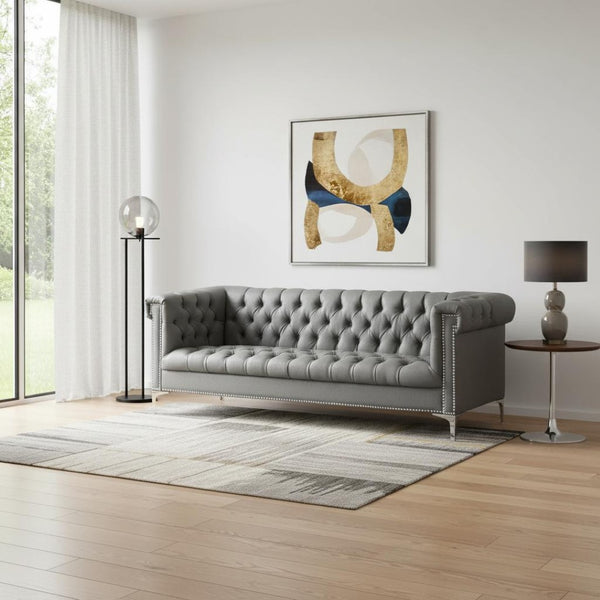 HomeRoots 85" Gray Faux Leather Sofa with Durable Frame, Tufted Design, and Stylish Nailhead Trim for Comfort 543962