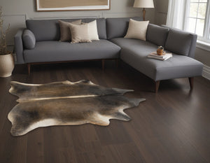 Homeroots 5' X 7' Dark Brown Cowhide Hand Knotted Area Rug Tan Cowhide 544319