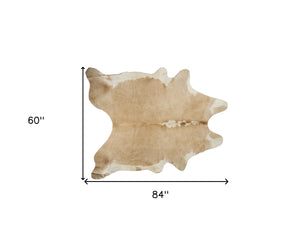 Homeroots 5' X 7' Brown And White Cowhide Hand Knotted Area Rug Tan And White Cowhide 544325