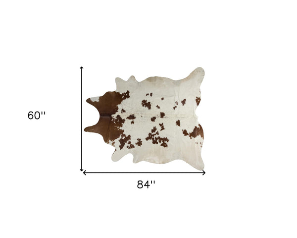 Homeroots 5' X 7' Brown And White Cowhide Hand Knotted Area Rug White & Brown Cowhide 544332