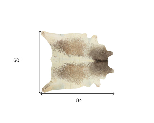 Homeroots 5' X 7' Brown And White Cowhide Hand Knotted Area Rug Tan And White Cowhide 544336