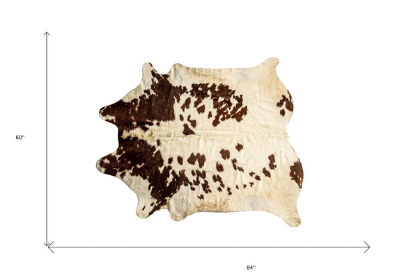 Homeroots 5' X 7' Brown And White Cowhide Hand Knotted Area Rug Brown And White Cowhide 544341