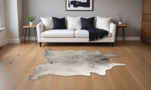Homeroots 5' X 7' Taupe And Ivory Cowhide Hand Knotted Area Rug Brown And White Cowhide 544342