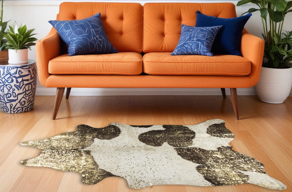 Homeroots 5' X 7' Ivory Brown And Gold Cowhide Hand Knotted Area Rug Brown And White Cowhide 544350