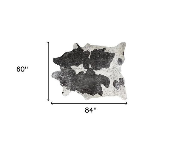 Homeroots 5' X 7' Black And White Cowhide Hand Knotted Area Rug Black And White Cowhide 544359