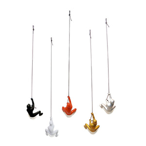 HomeRoots Set of Five Bold Resin Climbing Man Sculptures in Black, Gold, Orange, Silver & White - Ready to Hang! 544461