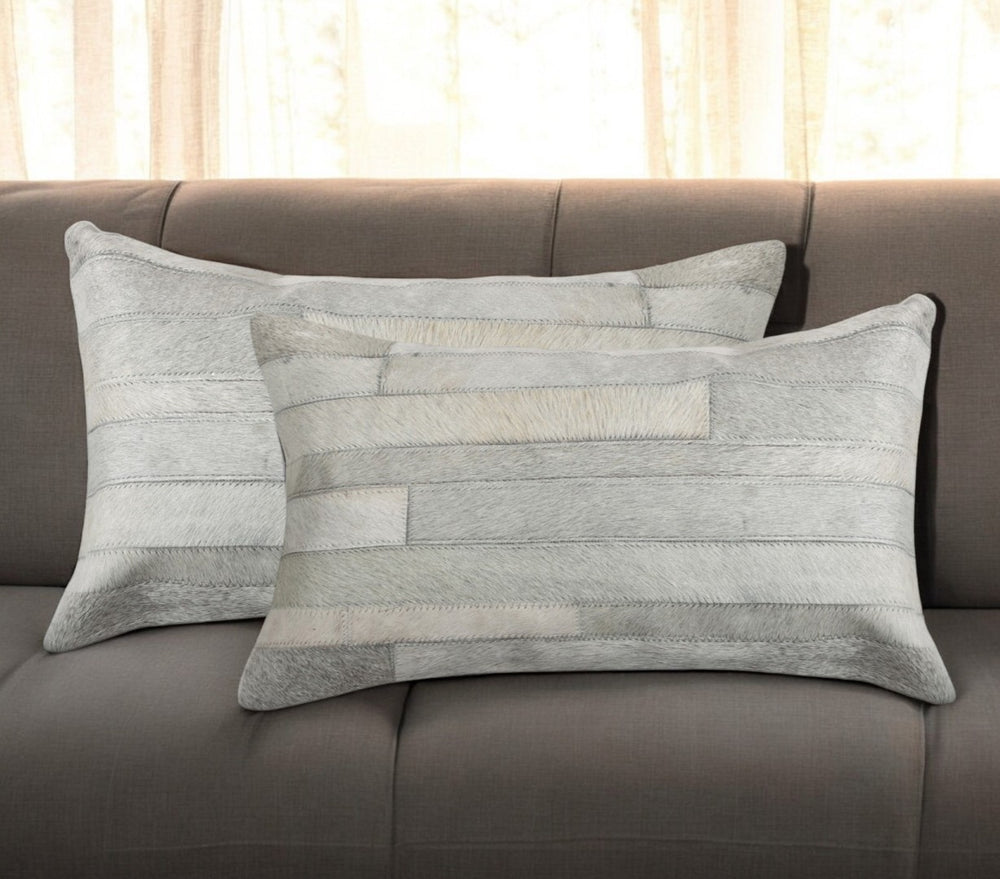 HomeRoots Set of Two 12" X 20" Gray Patchwork Cowhide Lumbar Pillows for Chic Rustic Home Décor & Comfort 544632