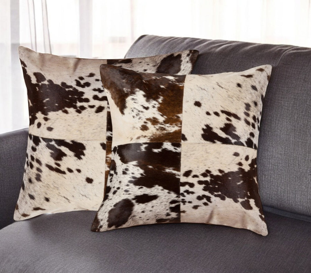 HomeRoots Set of Two 18" Chocolate & White Cowhide Throw Pillows - Rustic Elegance for Cozy Living Spaces 544640