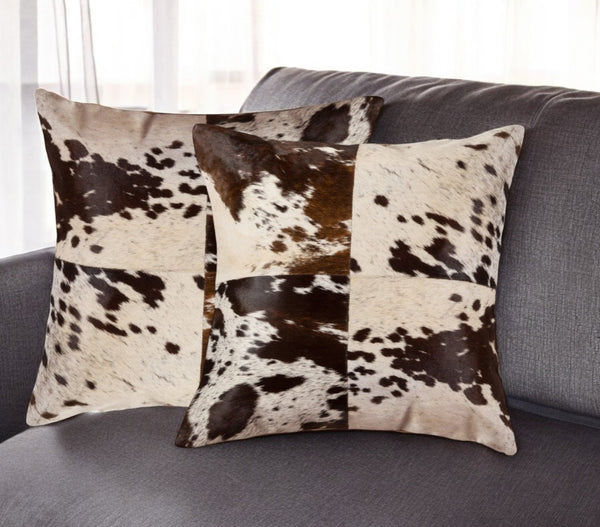 HomeRoots Set of Two 18" Chocolate & White Cowhide Throw Pillows - Rustic Elegance for Cozy Living Spaces 544640