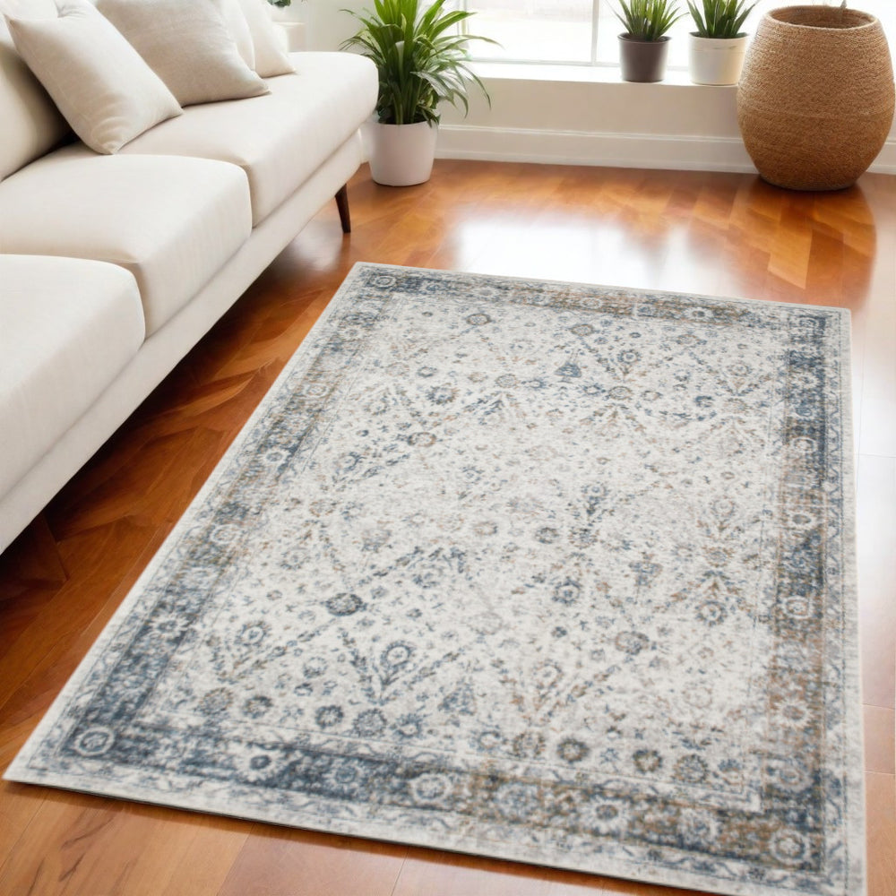 Homeroots 5' X 7' Blue And Ivory Floral Medallion Power Loom Distressed Washable Area Rug  Polyester 545097