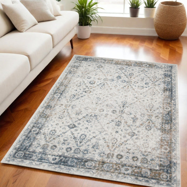 Homeroots 5' X 7' Blue And Ivory Floral Medallion Power Loom Distressed Washable Area Rug  Polyester 545097
