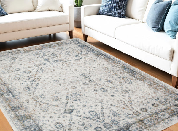 Homeroots 7' X 9' Blue And Ivory Floral Medallion Power Loom Distressed Washable Area Rug  Polyester 545098