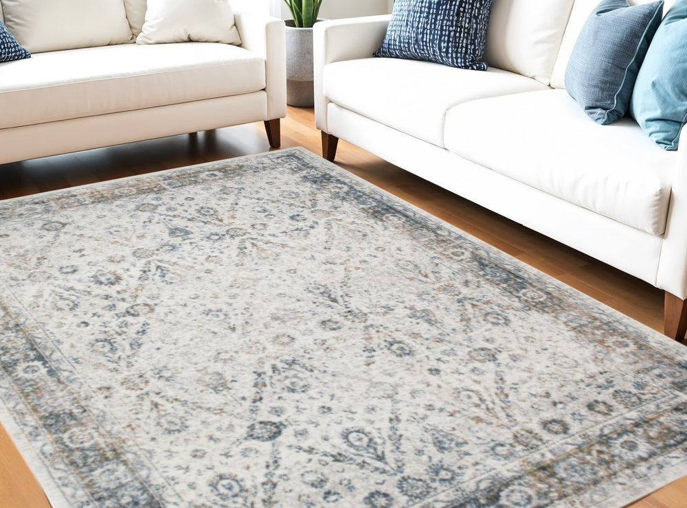 Homeroots 9' X 12' Blue And Ivory Floral Medallion Power Loom Distressed Washable Area Rug  Polyester 545100