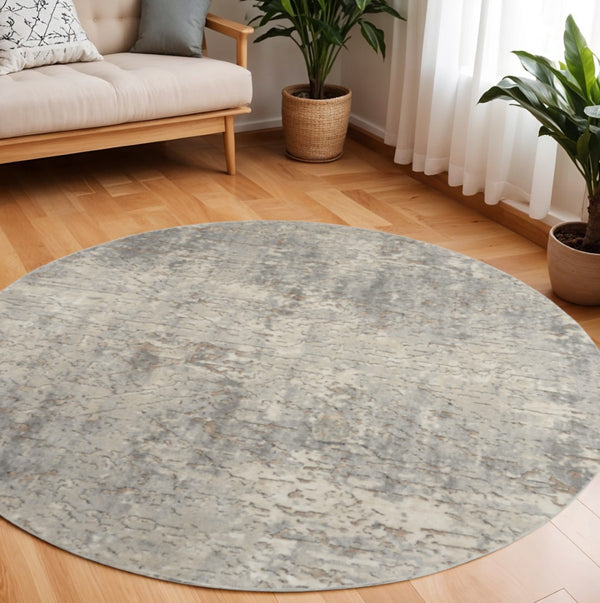 HomeRoots 8' Round Abstract Area Rug in Beige and Gray - Modern Power Loomed Design for Stylish Spaces 545132
