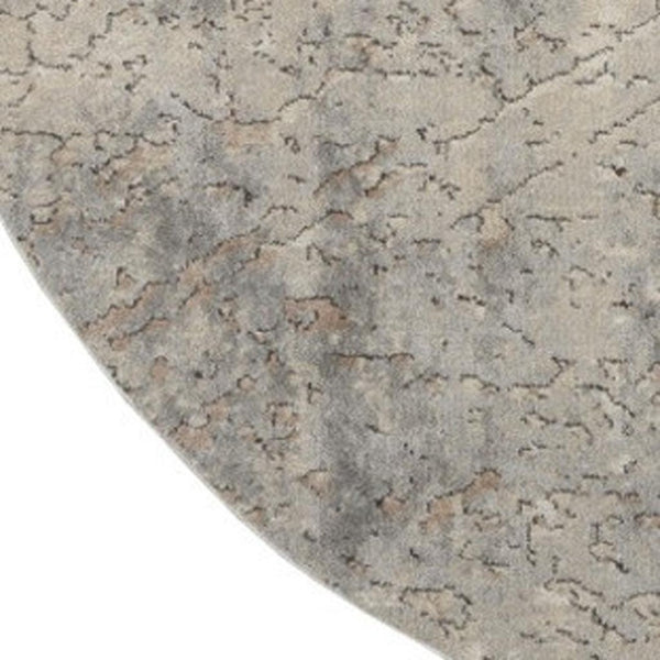 HomeRoots 8' Round Abstract Area Rug in Beige and Gray - Modern Power Loomed Design for Stylish Spaces 545132