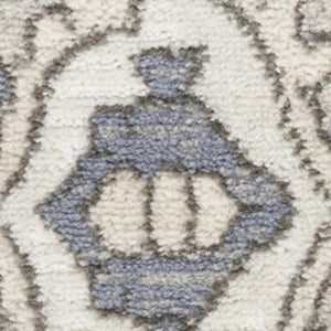 HomeRoots 5' Blue and Ivory Medallion Power Loom Area Rug - Vintage Charm, Distressed Design for Any Space 5' X 7' 545164