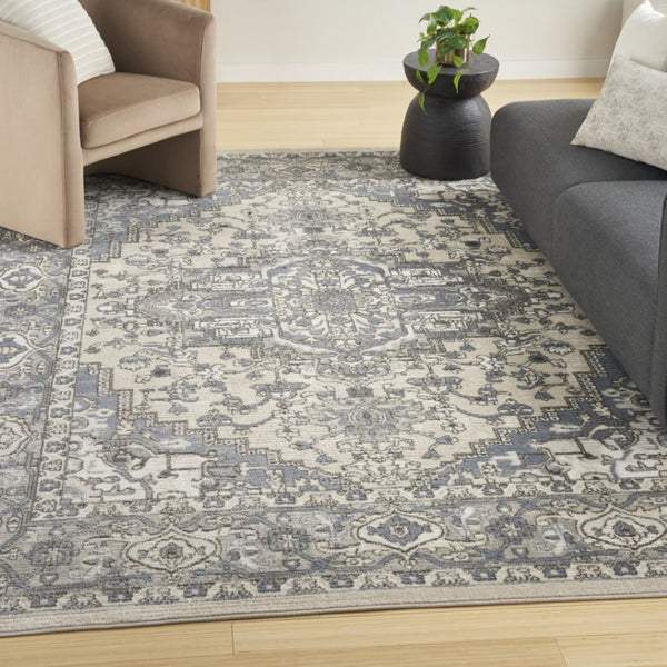 HomeRoots 5' Blue and Ivory Medallion Power Loom Area Rug - Vintage Charm, Distressed Design for Any Space 5' X 7' 545164