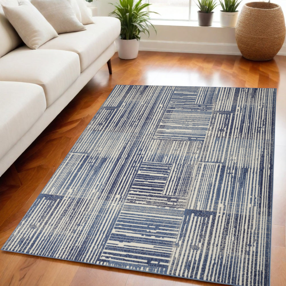 Homeroots 5' X 7' Blue And Gray Striped Power Loom Area Rug  Polypropylene 545337