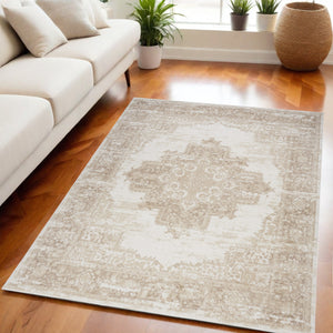 Homeroots 5' X 7' Beige And Ivory Medallion Power Loom Distressed Area Rug  Polypropylene 545415