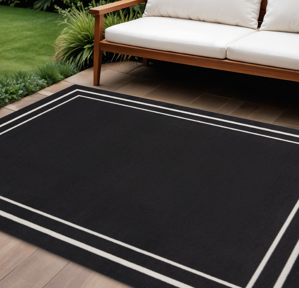 HomeRoots 10' X 14' Black And Ivory Area Rug – Durable Indoor/Outdoor Design for Modern Spaces & Easy Care 545467
