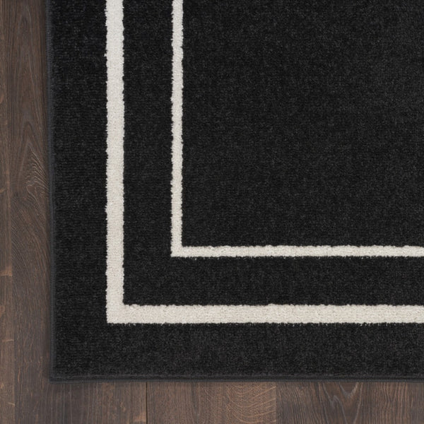 HomeRoots 10' X 14' Black And Ivory Area Rug – Durable Indoor/Outdoor Design for Modern Spaces & Easy Care 545467