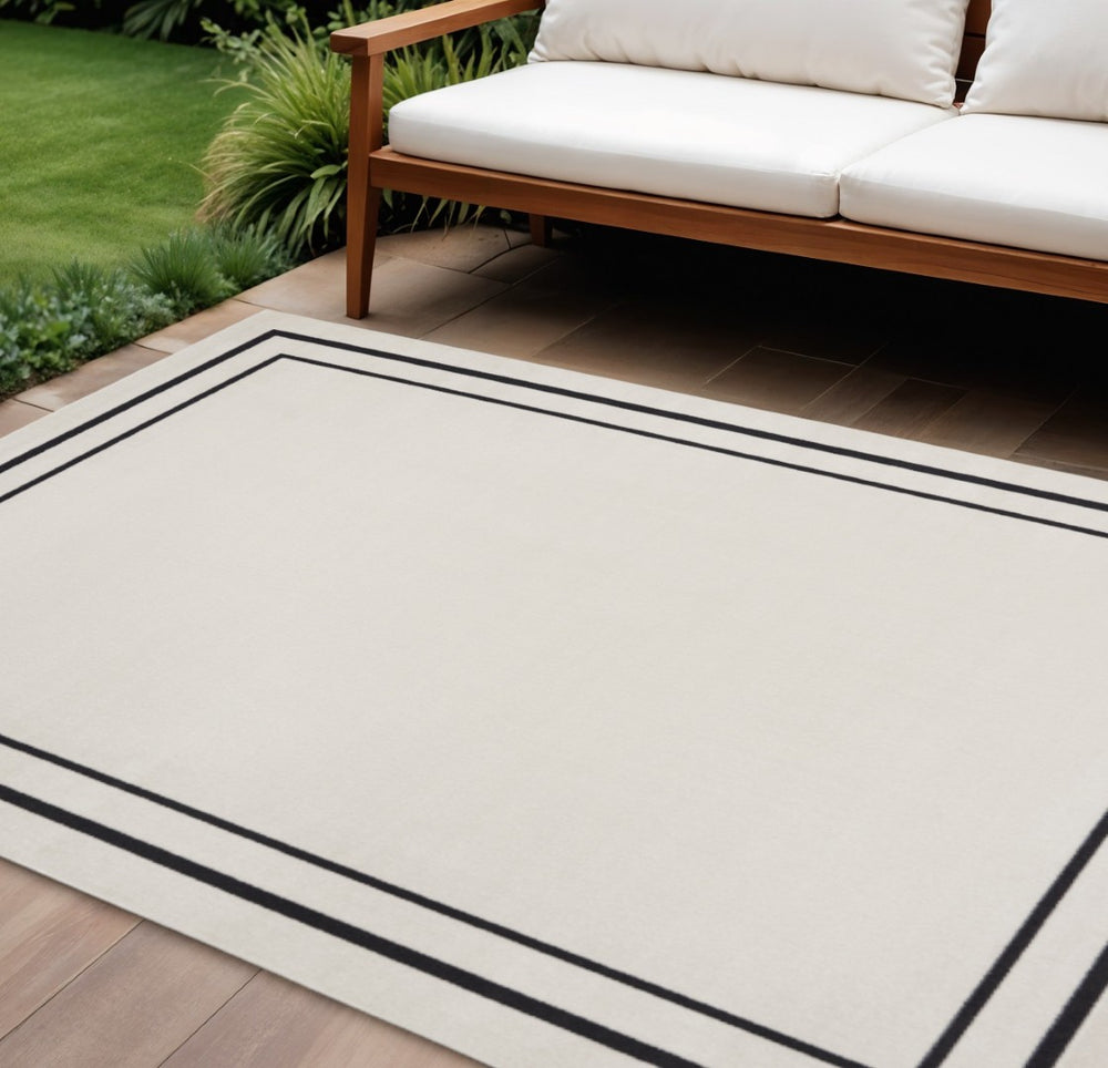 HomeRoots 10' X 14' Ivory and Black Area Rug - Stylish, Durable, and Versatile for Indoor & Outdoor Spaces! 545471
