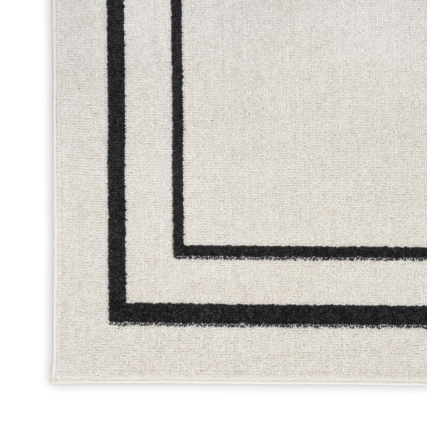 HomeRoots 10' X 14' Ivory and Black Area Rug - Stylish, Durable, and Versatile for Indoor & Outdoor Spaces! 545471