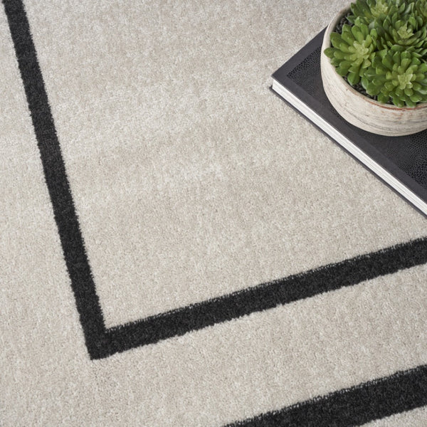 HomeRoots 10' X 14' Ivory and Black Area Rug - Stylish, Durable, and Versatile for Indoor & Outdoor Spaces! 545471
