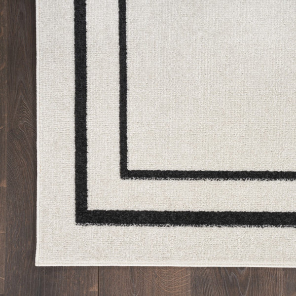 HomeRoots 10' X 14' Ivory and Black Area Rug - Stylish, Durable, and Versatile for Indoor & Outdoor Spaces! 545471