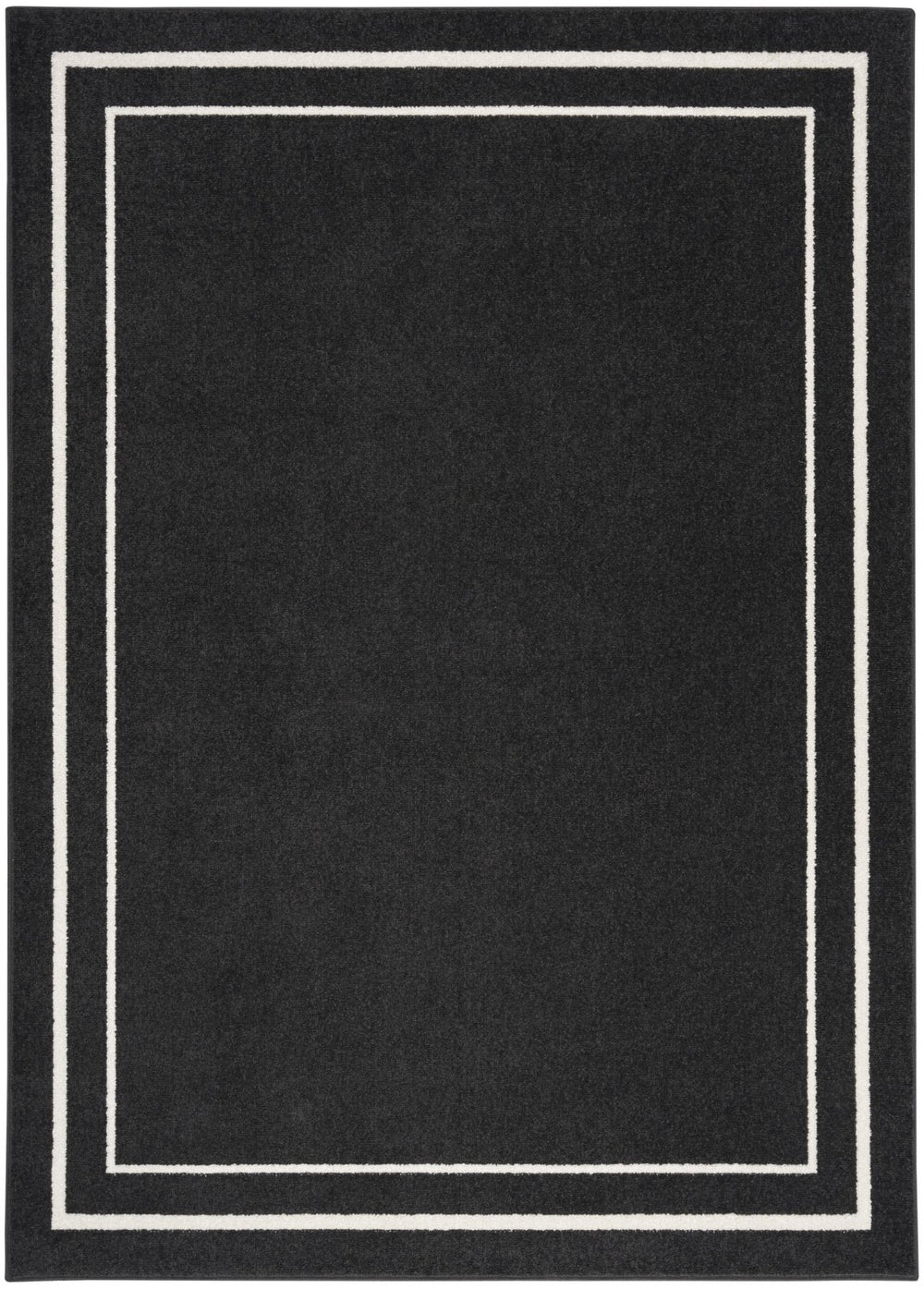 HomeRoots 6' X 9' Black and Ivory Indoor-Outdoor Area Rug - Durable, Stylish, Versatile for Every Space! 545490