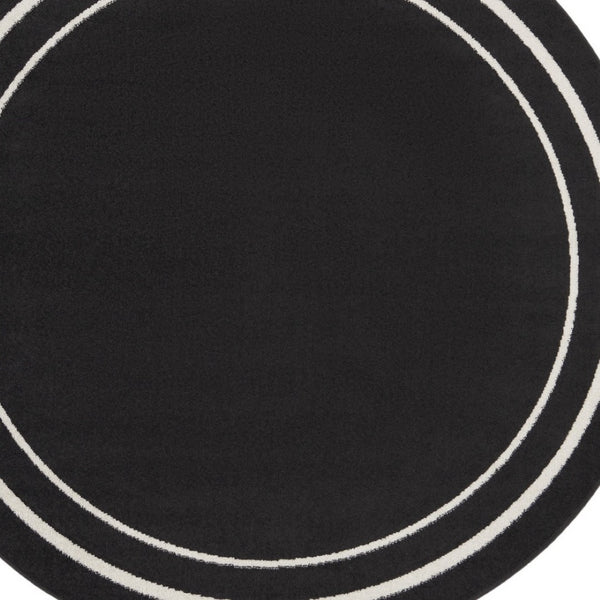 HomeRoots 8' Black And Ivory Round Area Rug - Stylish, Durable, Versatile for Indoor/Outdoor Spaces & High Traffic 545492