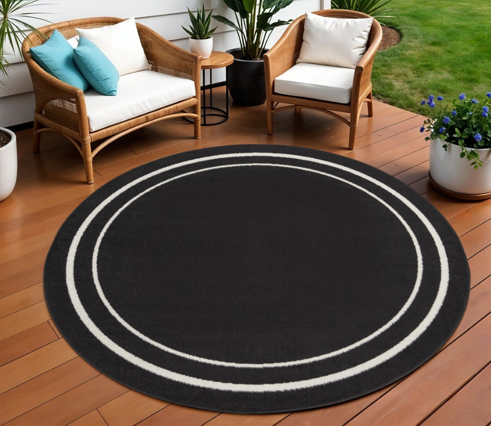 HomeRoots 8' Black And Ivory Round Area Rug - Stylish, Durable, Versatile for Indoor/Outdoor Spaces & High Traffic 545492
