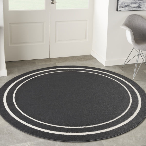 HomeRoots 8' Black And Ivory Round Area Rug - Stylish, Durable, Versatile for Indoor/Outdoor Spaces & High Traffic 545492